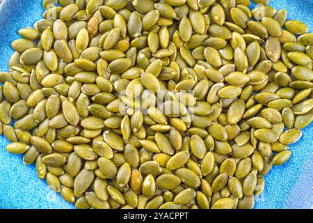 Close-up of roasted pumpkin seeds with salt. Stock Photo