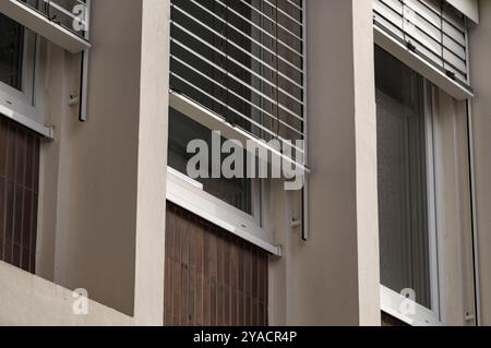 long rows of windows of an office building from the 1960s Stock Photo