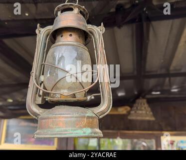 old retro miner vintage lantern on a wall Stock Photo