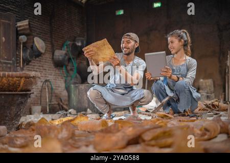 Artisans Collaboratively Engaging in a Vibrant and Creative Workshop Environment Stock Photo