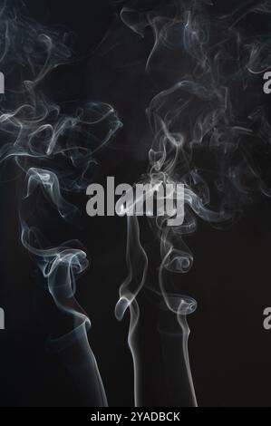 White vapour smoke curve isolated on black studio background Stock Photo