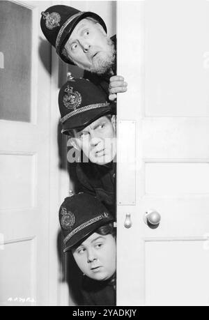 British Comedian WILL HAY with MOORE MARRIOTT and GRAHAM MOFFATT in a publicity portrait for ASK A POLICEMAN 1939 Director MARCEL VARNEL Story SYDNEY GILLIATT Screenplay MARRIOTT EDGAR, VAL GUEST and J.O.C. ORTON Producer EDWARD BLACK Gainsborough Pictures / General Film Distributors Stock Photo