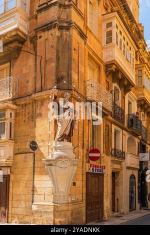 VALLETTA, MALTA - AUGUST 30 2024: Street view o Valletta with traditional Maltese buildings and colourful balconies. Stock Photo