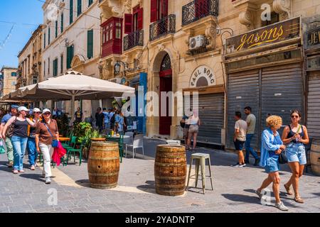 VALLETTA, MALTA - AUGUST 30 2024: People enjoy summer vacation in Valletta Stock Photo