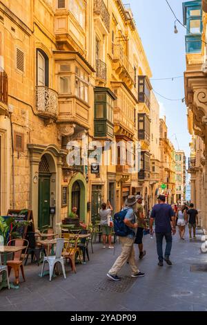 VALLETTA, MALTA - AUGUST 30 2024: People enjoy summer vacation in Valletta Stock Photo