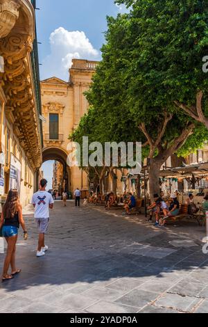 VALLETTA, MALTA - AUGUST 30 2024: People enjoy summer vacation in Valletta Stock Photo