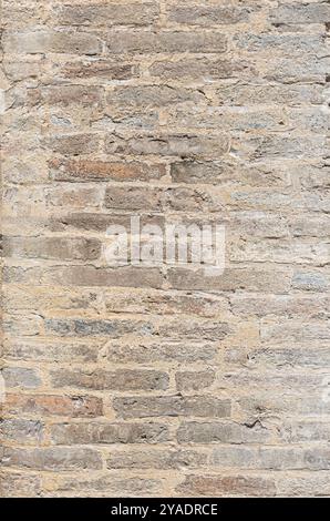 Brick wall of beige stone background Stock Photo