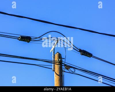 New telegraph post with telephone and fiber optic cables for hi-speed internet - Preuilly-sur-Claise, Indre-et-Loire (37), France. Stock Photo