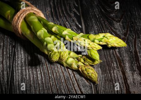 asparagus on black wood background Stock Photo