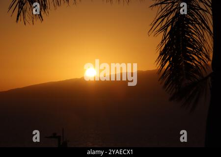 Sun going down over the mountain Stock Photo