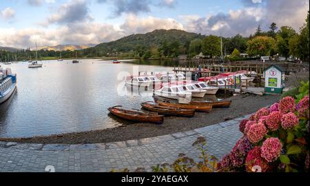 WATERHEAD, AMBLESIDE, UK - SEPTEMBER 11, 2024. Pleasure boats and rowing boats for hire from Ambleside Pier at Waterhead on the Northern end of Lake W Stock Photo