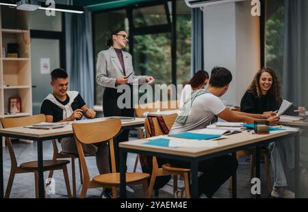 Engaged students interacting during a lively classroom session Stock Photo