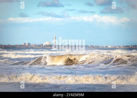 breaking waves on cambois beach near blyth northumberland Stock Photo