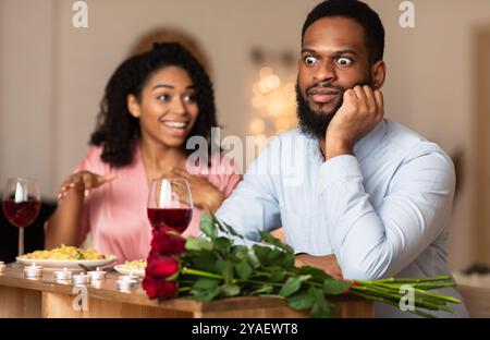 Black Couple On Unsuccessful Blind Date In Restaurant Stock Photo