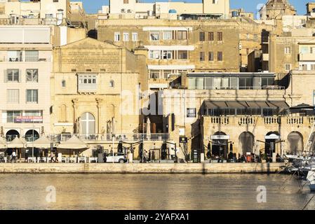 Valletta, Malta, 01 06 2022: Panoramic view over the harbor and coastal line with blue water and sky, Europe Stock Photo