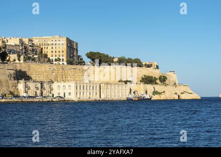 Valletta, Malta, 01 06 2022: Panoramic view over the harbor and coastal line with blue water and sky, Europe Stock Photo