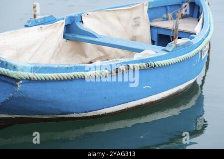 Marsaxlokk, Malta, 01 07 2022: Small blue vessel at the harbor, Europe Stock Photo