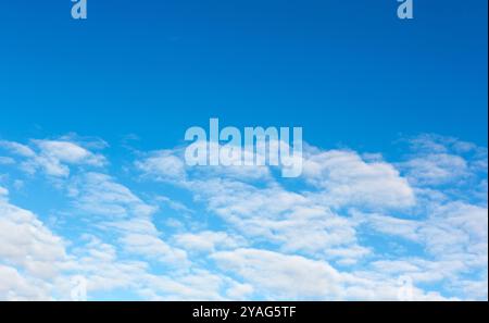 Clear blue sky,  soft white clouds. Blue sky as a background Stock Photo