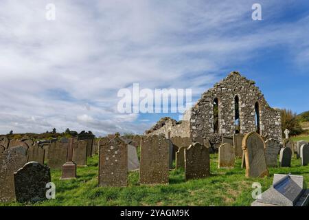 The west gable and outer walls of Cowie Chapel near to Stonehaven Golf Club on the East coast of Scotland under an October sky. Stock Photo