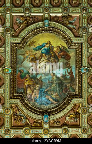 The coffered ceiling and in the center the large canvas depicting the Assumption of Mary into Heaven in the Cathedral of Santa Maria Assunta. Avellino Stock Photo