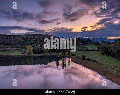 Aerial view of the Estany de Montcortès lake, on a cloudy sunrise in Baix Pallars (Pallars Sobirà, Lleida, Catalonia, Spain, Pyrenees) Stock Photo