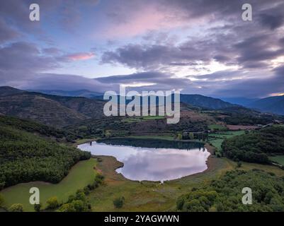 Aerial view of the Estany de Montcortès lake, on a cloudy sunrise in Baix Pallars (Pallars Sobirà, Lleida, Catalonia, Spain, Pyrenees) Stock Photo