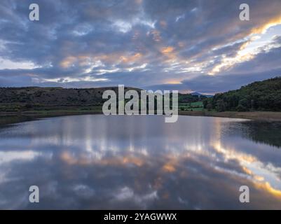 Aerial view of the Estany de Montcortès lake, on a cloudy sunrise in Baix Pallars (Pallars Sobirà, Lleida, Catalonia, Spain, Pyrenees) Stock Photo