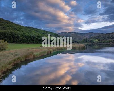 Aerial view of the Estany de Montcortès lake, on a cloudy sunrise in Baix Pallars (Pallars Sobirà, Lleida, Catalonia, Spain, Pyrenees) Stock Photo