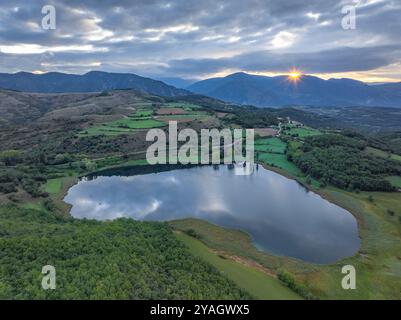 Aerial view of the Estany de Montcortès lake, on a cloudy sunrise in Baix Pallars (Pallars Sobirà, Lleida, Catalonia, Spain, Pyrenees) Stock Photo