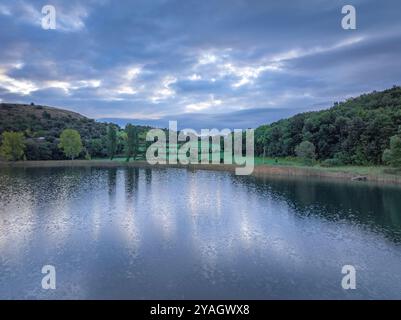 Aerial view of the Estany de Montcortès lake, on a cloudy sunrise in Baix Pallars (Pallars Sobirà, Lleida, Catalonia, Spain, Pyrenees) Stock Photo