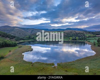 Aerial view of the Estany de Montcortès lake, on a cloudy sunrise in Baix Pallars (Pallars Sobirà, Lleida, Catalonia, Spain, Pyrenees) Stock Photo