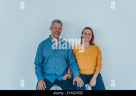 Two happy friendly diverse professionals,man and woman partnership teamwork and team motivation in office work. High quality photo Stock Photo