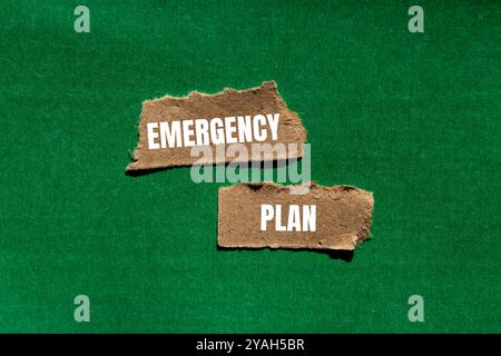 Emergency plan message written on ripped torn paper pieces with green background. Conceptual emergency plan symbol. Copy space. Stock Photo