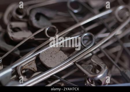 Close-up of a Pile of Silver Safety Pins with Shallow Depth of Field Stock Photo