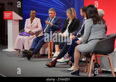 (left to right) Actress, writer, director and producer Adjoa Andoh, Sir Lucian Grainge, chairman and CEO of Universal Music Group, Dr Anna Mallett, vice president (production) at Netflix, former head coach of the England men's football team Gareth Southgate, Maria Balshaw, director of the Tate (obscured) and Culture Secretary Lisa Nandy, taking part in the 'UK's creative assets: Soft power as a hard investment opportunity' discussion during the International Investment Summit in London, as the Government seeks to woo investors to the UK. Picture date: Monday October 14, 2024. Stock Photo