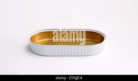 Close-up of an empty oval tin can on a white background. Stock Photo