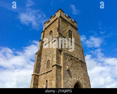 View looking up at the tower of St Michael's Church on Glastonbury Tor in summer Somerset England UK Stock Photo