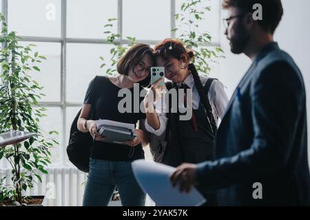 Students engaging with professor in bright study space Stock Photo