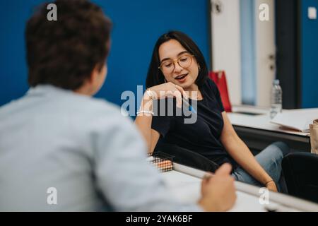 Engaged students in lively discussion during a classroom session Stock Photo