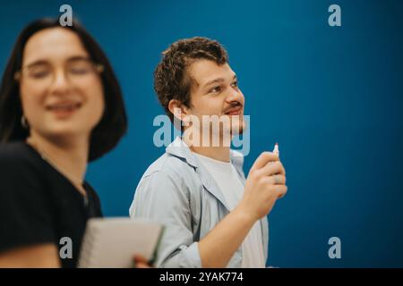 Two students engaged in a collaborative classroom setting Stock Photo
