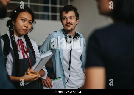 Students engaging with professor in an outdoor educational setting Stock Photo