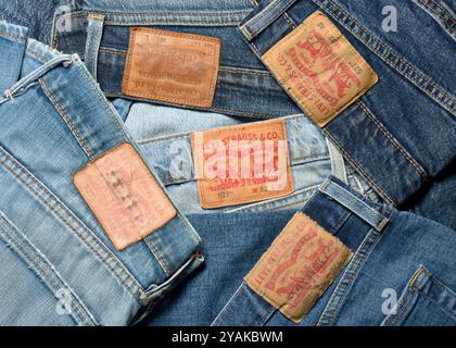 Levi Strauss original jeans various models leather labels close up detail from above Stock Photo