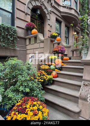 Halloween decorations on Brownstone apartment steps in Upper West Side district of Manhattan New York City NY USA October 2024 Stock Photo
