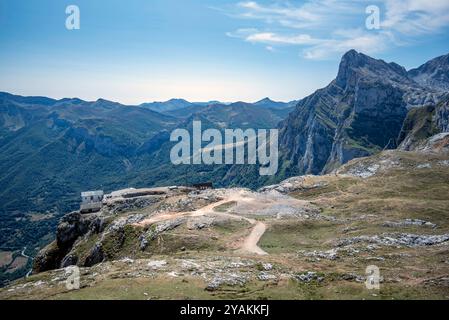 View of a cable car station at the top of the mountain, with hiking trails, Alfonso mountains and a blue sky with small white clouds Stock Photo