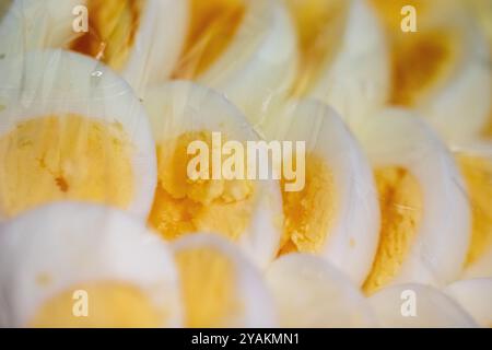 Sliced Eggs as a condiment under plastic wrap Stock Photo