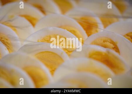 Sliced Eggs as a condiment under plastic wrap Stock Photo