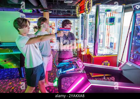 Trieste Italy,Norwegian Cruise Line NCL Escape ship,10-day Mediterranean Adriatic Sea itinerary,onboard inside interior,passengers teen boys playing s Stock Photo