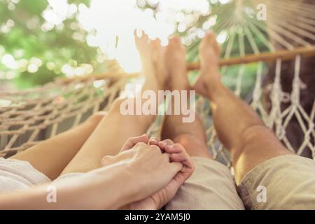 Couple relaxing in the hammock. Stock Photo