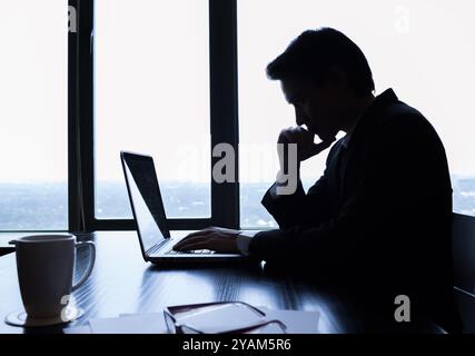 Businessman using laptop in the office. Stock Photo