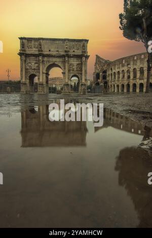 Rainy weather in the morning, sunrise in an old historic city. Beautiful details and historic Roman buildings of the Eternal City, Arco di Costantino Stock Photo